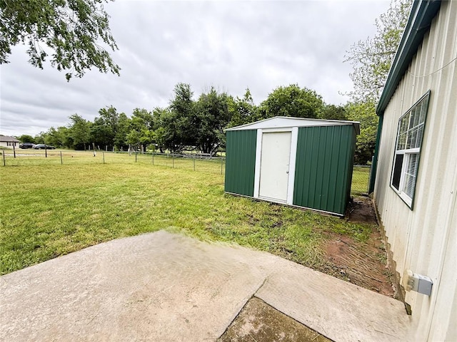 312 N 6th St, Amber, OK 73004 - view of yard featuring a storage unit, an outdoor structure, and a patio area