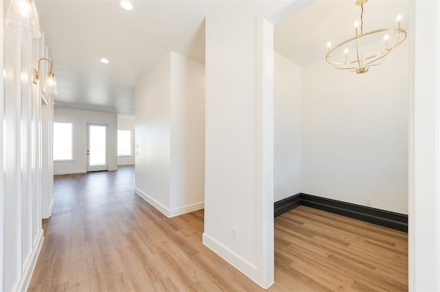 9213 NW 85th St, Yukon, OK 73099 - corridor featuring a chandelier, wood finished floors, baseboards, and recessed lighting