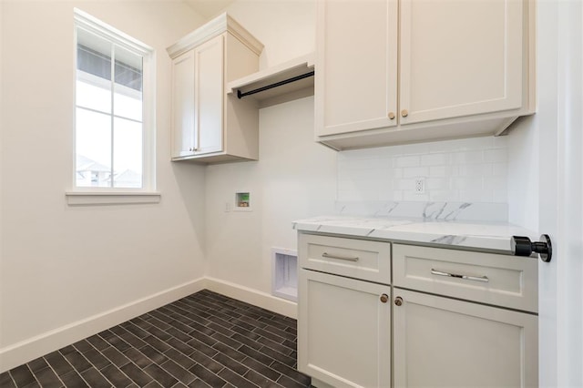 9213 NW 85th St, Yukon, OK 73099 - laundry area with baseboards, cabinet space, washer hookup, and brick patterned flooring