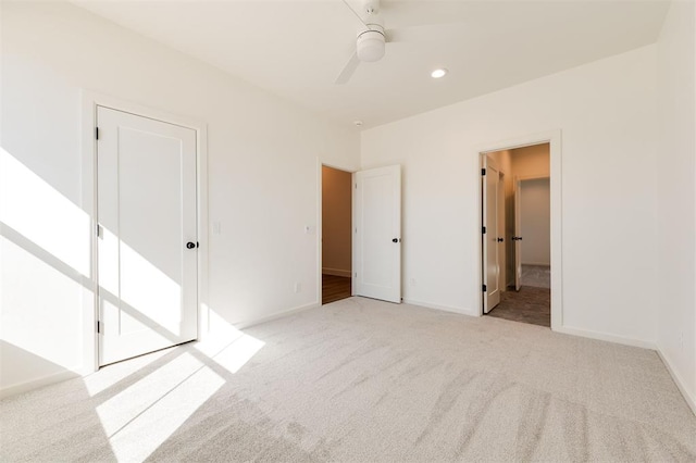 9213 NW 85th St, Yukon, OK 73099 - unfurnished bedroom with light colored carpet, recessed lighting, ceiling fan, and baseboards