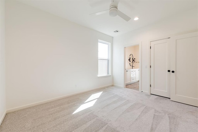 9213 NW 85th St, Yukon, OK 73099 - unfurnished bedroom featuring light colored carpet, baseboards, recessed lighting, a ceiling fan, and ensuite bath