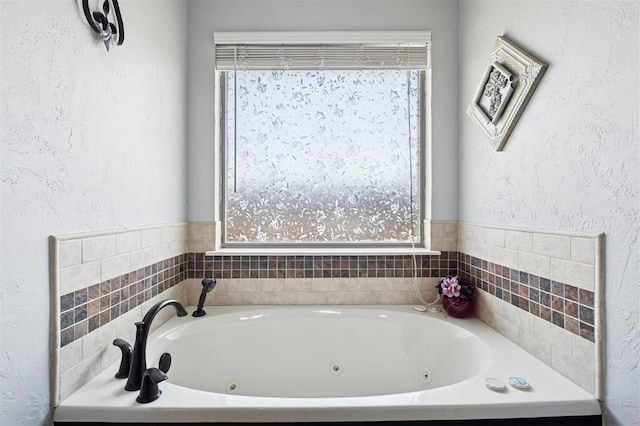 7941 E Sorghum Mill Rd, Edmond, OK 73034 - bathroom with a whirlpool tub and a textured wall