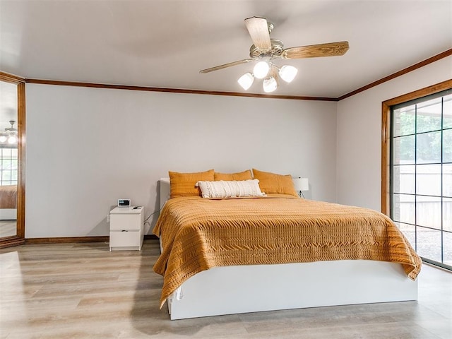 bedroom featuring ornamental molding, wood finished floors, a ceiling fan, access to exterior, and baseboards