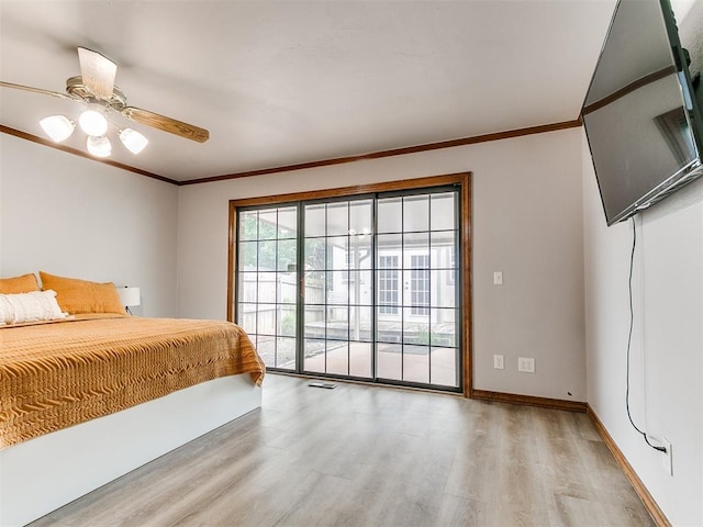 bedroom featuring wood finished floors, access to outside, ornamental molding, baseboards, and ceiling fan