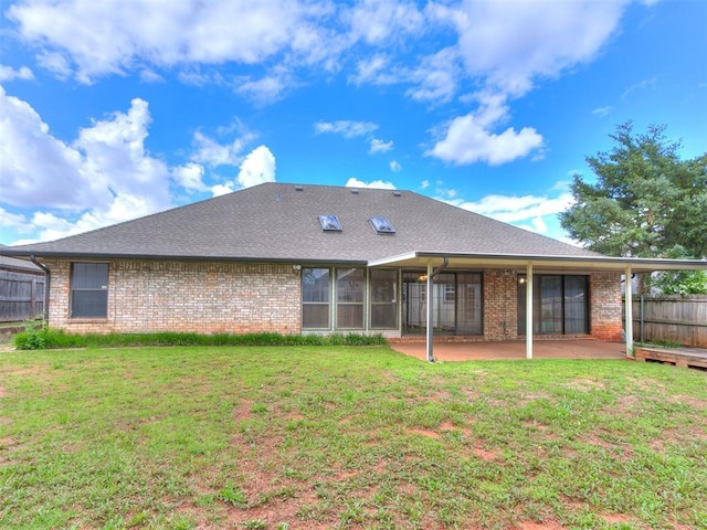 back of house with a patio, brick siding, and a shingled roof