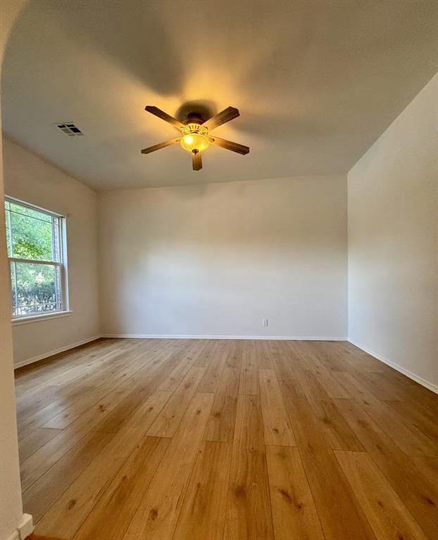 1918 W K Ct, Jenks, OK 74037 - unfurnished room with light wood-style floors, ceiling fan, and baseboards