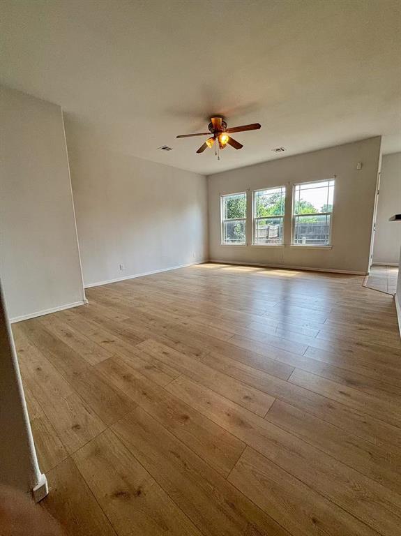 1918 W K Ct, Jenks, OK 74037 - empty room featuring ceiling fan, wood-type flooring, and baseboards