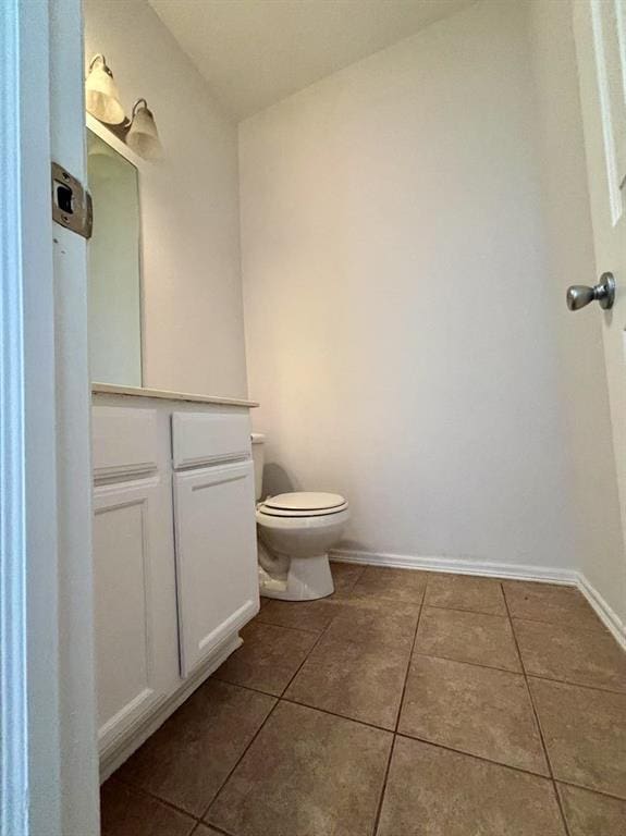 1918 W K Ct, Jenks, OK 74037 - bathroom with tile patterned floors, toilet, vanity, and baseboards