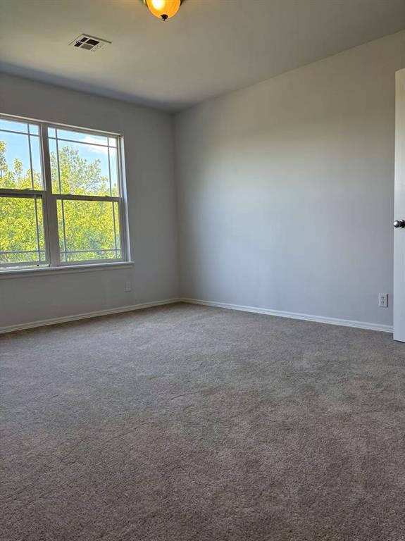 1918 W K Ct, Jenks, OK 74037 - spare room with baseboards and carpet floors