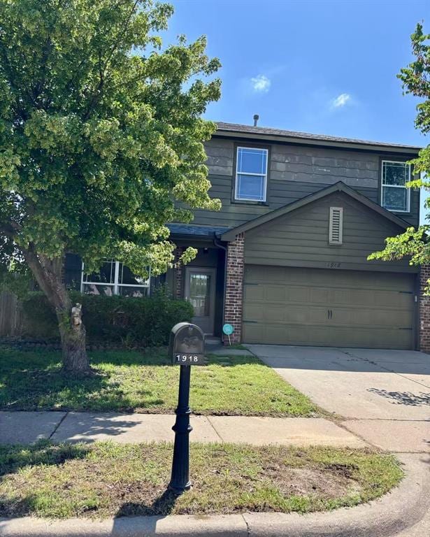 1918 W K Ct, Jenks, OK 74037 - view of front of home featuring driveway and brick siding