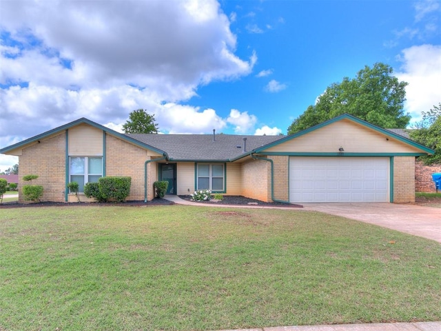 ranch-style home with brick siding, a garage, concrete driveway, and a front yard