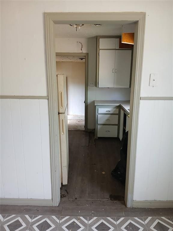 kitchen featuring freestanding refrigerator and light countertops