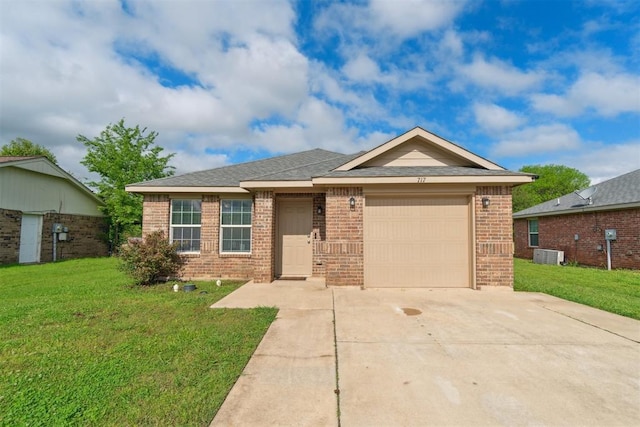 717 S Geronimo Ln, Pauls Valley, OK 73075 - ranch-style house with brick siding, a garage, driveway, central air condition unit, and a front yard