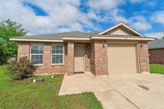 717 S Geronimo Ln, Pauls Valley, OK 73075 - ranch-style home with brick siding, an attached garage, and driveway
