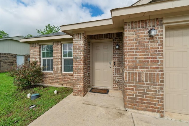 717 S Geronimo Ln, Pauls Valley, OK 73075 - view of exterior entry featuring brick siding