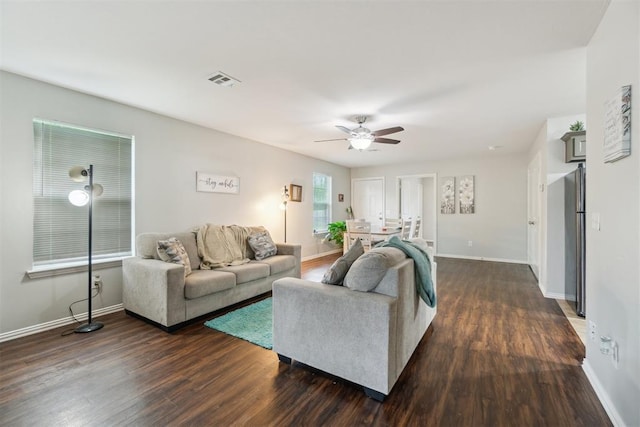 717 S Geronimo Ln, Pauls Valley, OK 73075 - living area with dark wood finished floors, ceiling fan, and baseboards
