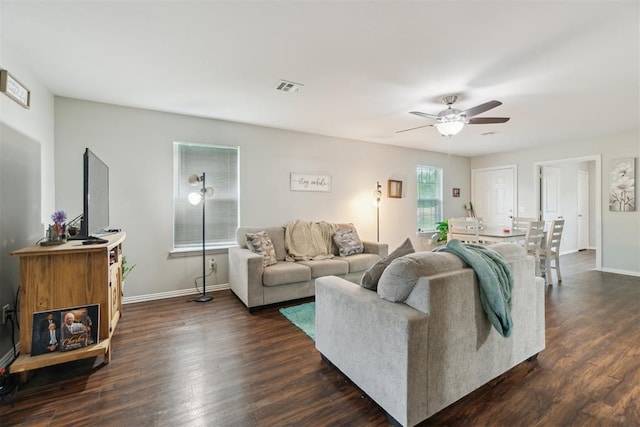 717 S Geronimo Ln, Pauls Valley, OK 73075 - living room with ceiling fan, baseboards, and dark wood-type flooring