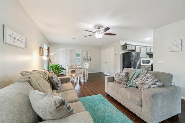 717 S Geronimo Ln, Pauls Valley, OK 73075 - living room with dark wood-style floors, a ceiling fan, and baseboards