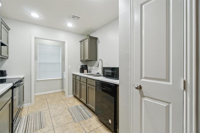 717 S Geronimo Ln, Pauls Valley, OK 73075 - kitchen with black appliances, a sink, light countertops, light tile patterned flooring, and recessed lighting