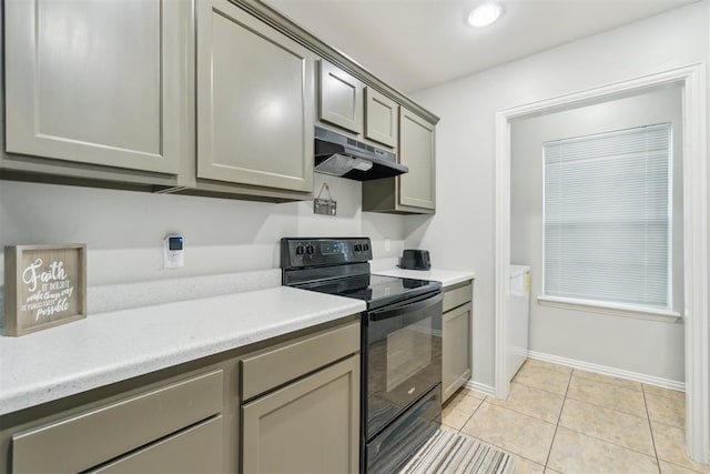 717 S Geronimo Ln, Pauls Valley, OK 73075 - kitchen with black range with electric cooktop, under cabinet range hood, gray cabinets, light countertops, and light tile patterned flooring