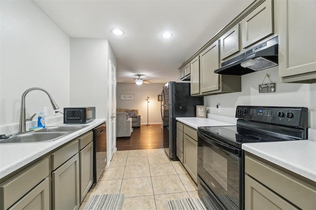 717 S Geronimo Ln, Pauls Valley, OK 73075 - kitchen featuring black appliances, under cabinet range hood, a sink, light countertops, and ceiling fan
