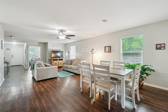 717 S Geronimo Ln, Pauls Valley, OK 73075 - dining room with dark wood-style floors, a ceiling fan, and baseboards