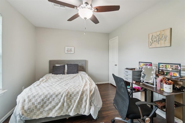717 S Geronimo Ln, Pauls Valley, OK 73075 - bedroom with a desk, wood finished floors, baseboards, and a ceiling fan
