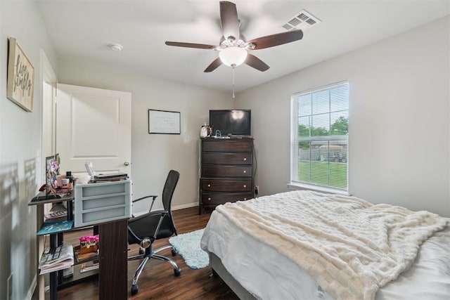 717 S Geronimo Ln, Pauls Valley, OK 73075 - bedroom with dark wood finished floors, an office area, baseboards, and ceiling fan