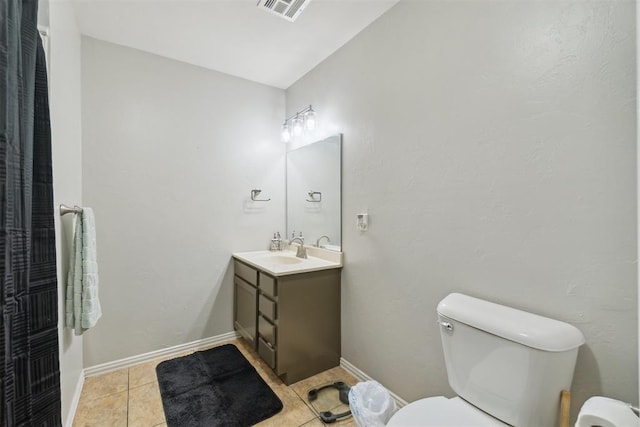 717 S Geronimo Ln, Pauls Valley, OK 73075 - bathroom with toilet, vanity, and tile patterned floors