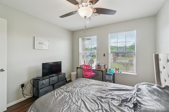 717 S Geronimo Ln, Pauls Valley, OK 73075 - bedroom with baseboards, dark wood-style flooring, and ceiling fan