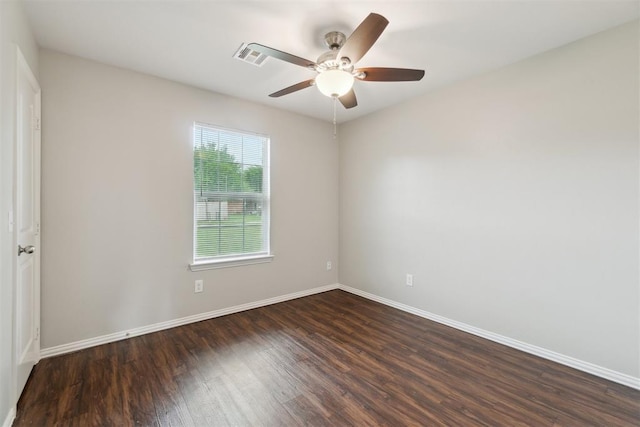 717 S Geronimo Ln, Pauls Valley, OK 73075 - empty room with dark wood finished floors, ceiling fan, and baseboards