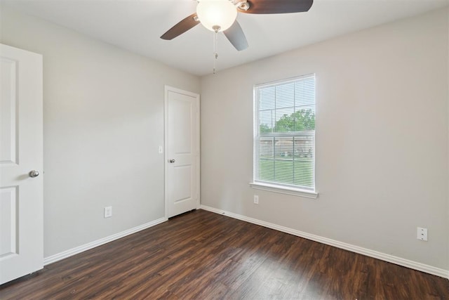 717 S Geronimo Ln, Pauls Valley, OK 73075 - empty room featuring dark wood-style flooring, baseboards, and ceiling fan