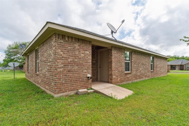 717 S Geronimo Ln, Pauls Valley, OK 73075 - rear view of house with brick siding and a lawn