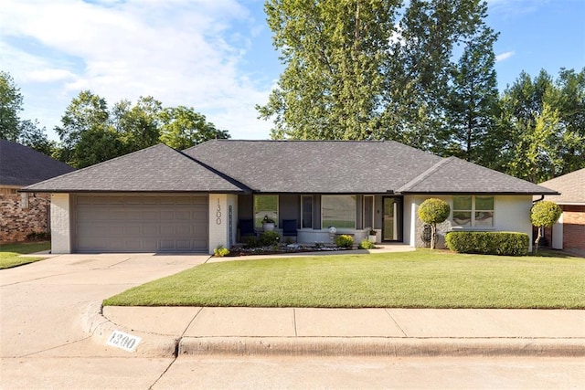 ranch-style home with driveway, an attached garage, a front yard, and roof with shingles