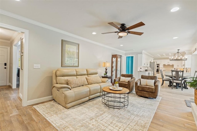 living area featuring recessed lighting, a ceiling fan, baseboards, ornamental molding, and light wood-style floors