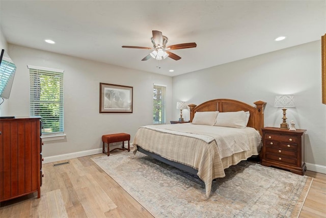 bedroom with baseboards, light wood finished floors, recessed lighting, and ceiling fan