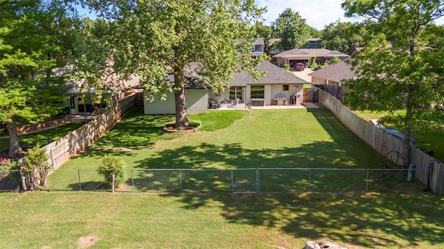 view of yard featuring a gate and a patio