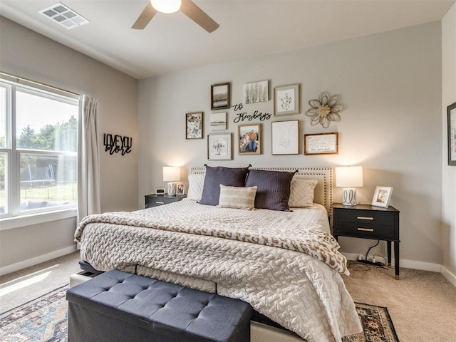bedroom featuring carpet, baseboards, and a ceiling fan