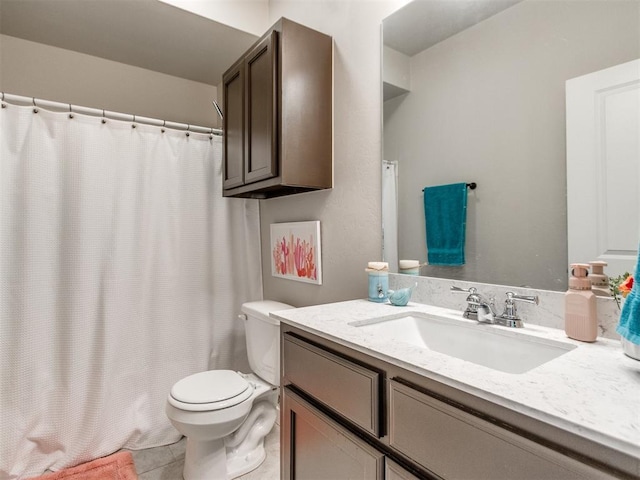 full bath featuring toilet, vanity, tile patterned floors, and a shower with shower curtain