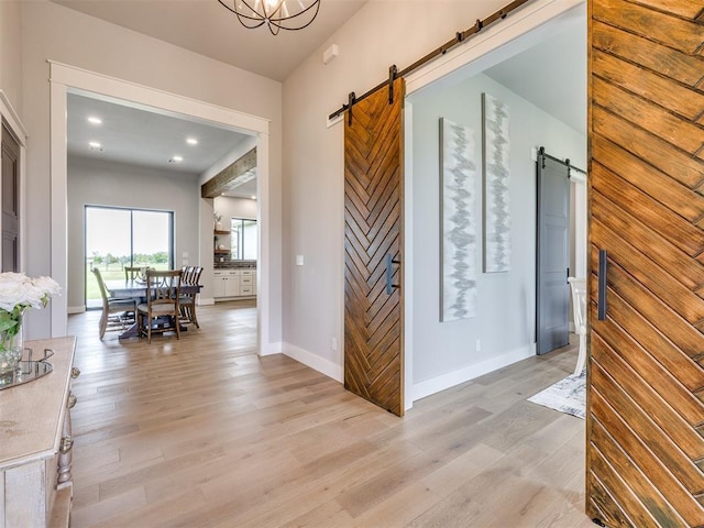 3241 E 171st St, Bixby, OK 74008 - hall with a barn door, light wood-style floors, baseboards, and recessed lighting