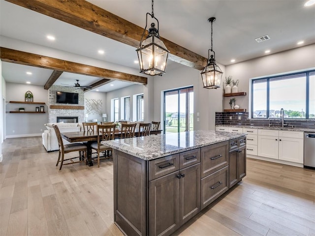 3241 E 171st St, Bixby, OK 74008 - kitchen featuring beam ceiling, dishwasher, white cabinetry, light stone counters, and light wood finished floors