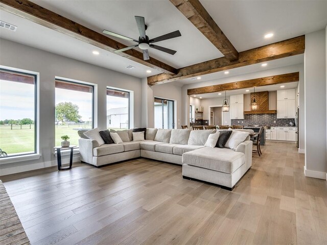 3241 E 171st St, Bixby, OK 74008 - living room with beamed ceiling, recessed lighting, plenty of natural light, light wood-style flooring, and ceiling fan