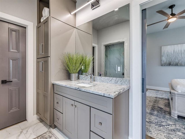 3241 E 171st St, Bixby, OK 74008 - full bathroom featuring ceiling fan, vanity, a stall shower, baseboards, and marble finish floors