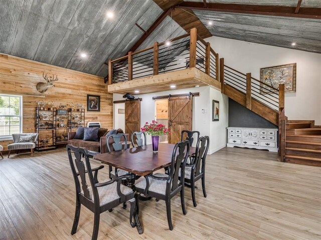 3241 E 171st St, Bixby, OK 74008 - dining room featuring high vaulted ceiling, a barn door, stairs, wood finished floors, and recessed lighting