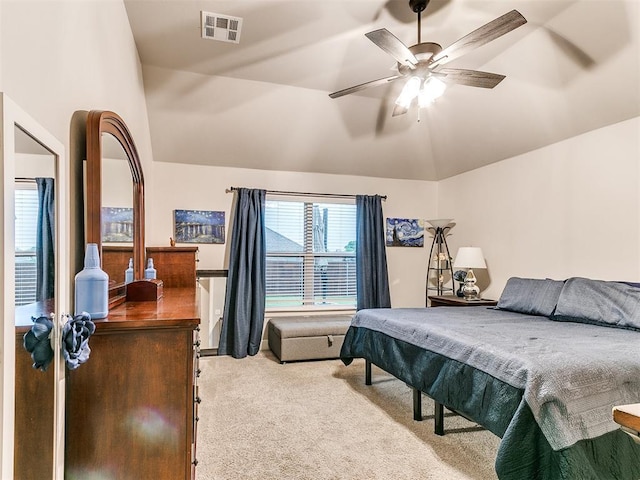 carpeted bedroom with lofted ceiling and a ceiling fan