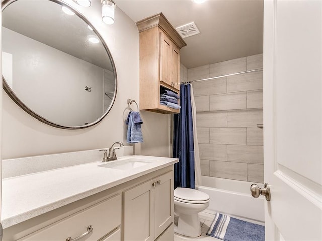 full bath featuring tile patterned floors, vanity, toilet, and shower / bath combination with curtain