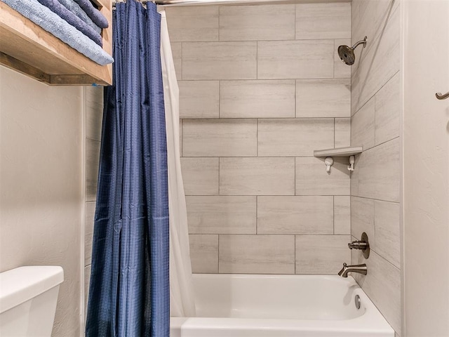 full bath featuring shower / bath combo and toilet