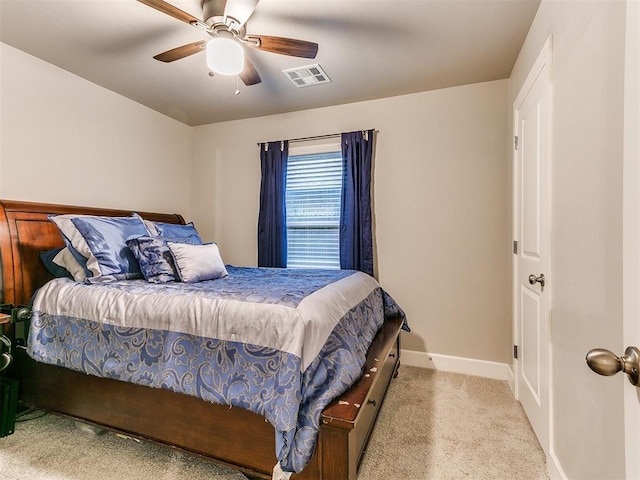 carpeted bedroom with baseboards and a ceiling fan