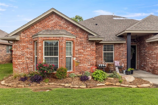 13141 Austrian Pine Dr, Choctaw, OK 73020 - rear view of house with a shingled roof and brick siding