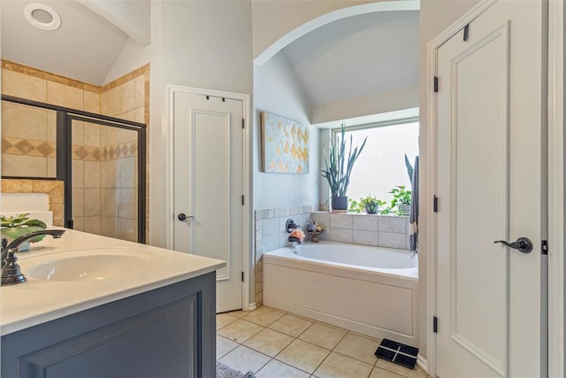 13141 Austrian Pine Dr, Choctaw, OK 73020 - full bath with vaulted ceiling, tile patterned flooring, a stall shower, a garden tub, and double vanity